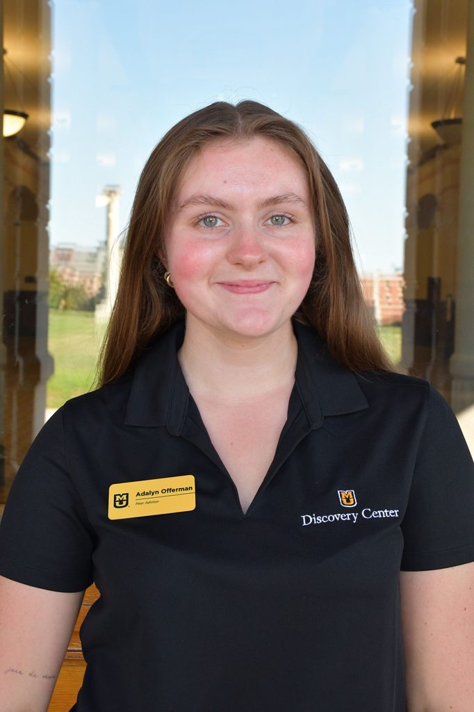 Headshot of Adalyn Offerman, a peer advisor at the University of Missouri, smiling in a black polo shirt.