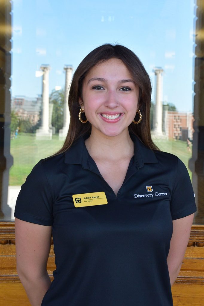 Headshot of Addie Reyes, a peer advisor at the University of Missouri, smiling in a black polo shirt.