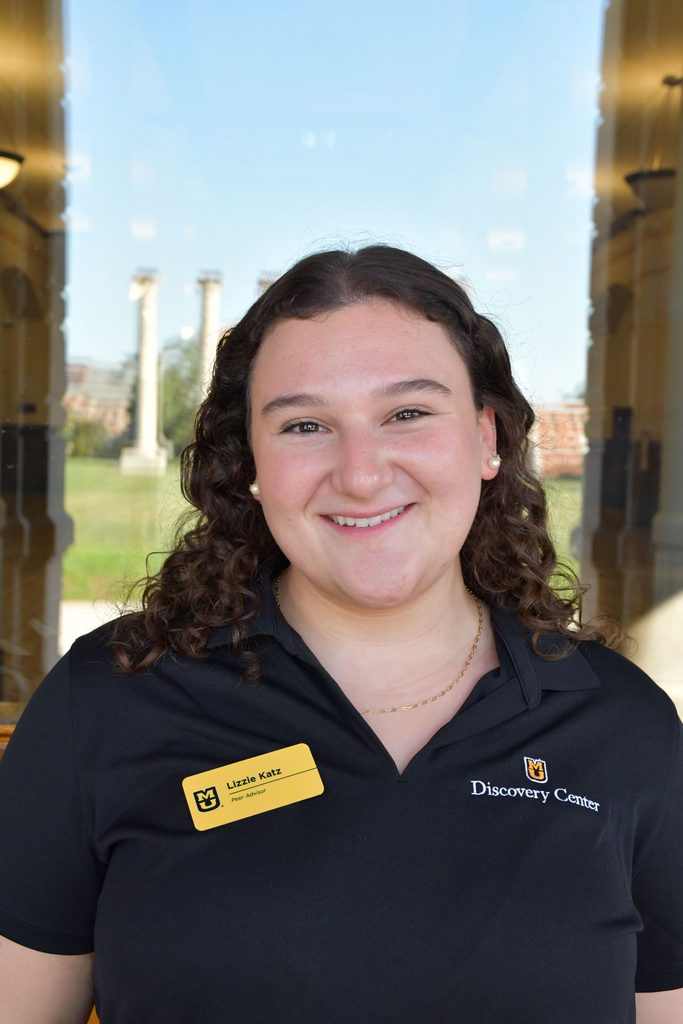 Headshot of Lizzie Katz, a peer advisor at the University of Missouri, smiling in a black polo shirt.